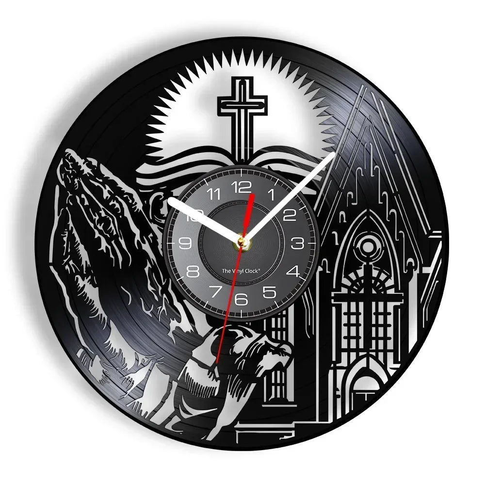 black wall clock featuring a silhouette of Jesus wearing a crown of thorns and a cross in the background made from recycled records