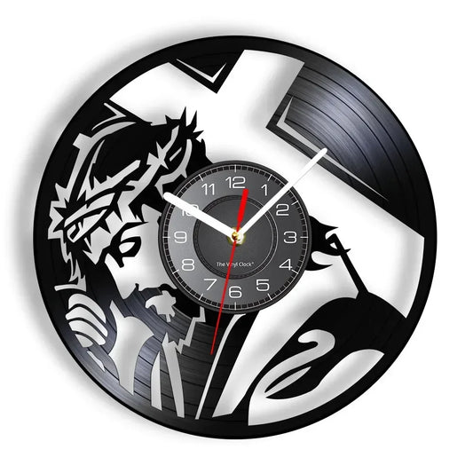 black wall clock featuring a silhouette of Jesus wearing a crown of thorns and a cross in the background made from recycled records